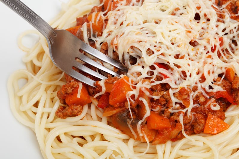 Spaghetti with meat sauce and Parmesan cheese